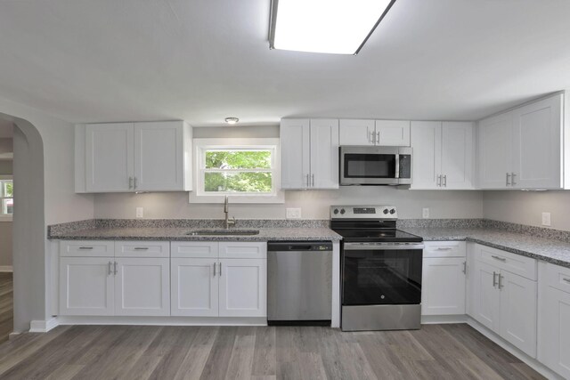 901 E Vine St, Mount Vernon, OH 43050 - kitchen with appliances with stainless steel finishes, a sink, and white cabinets