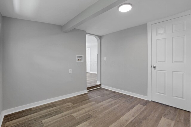 901 E Vine St, Mount Vernon, OH 43050 - basement with arched walkways, wood finished floors, and baseboards