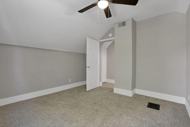 901 E Vine St, Mount Vernon, OH 43050 - bonus room with light colored carpet, vaulted ceiling, a ceiling fan, and baseboards
