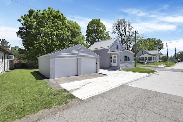 901 E Vine St, Mount Vernon, OH 43050 - view of front of property featuring a garage, an outbuilding, and a front lawn