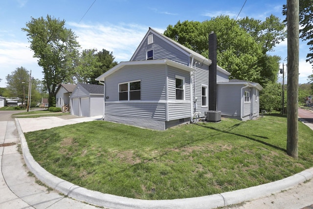 901 E Vine St, Mount Vernon, OH 43050 - view of front of property with a garage, a chimney, a front yard, and cooling unit