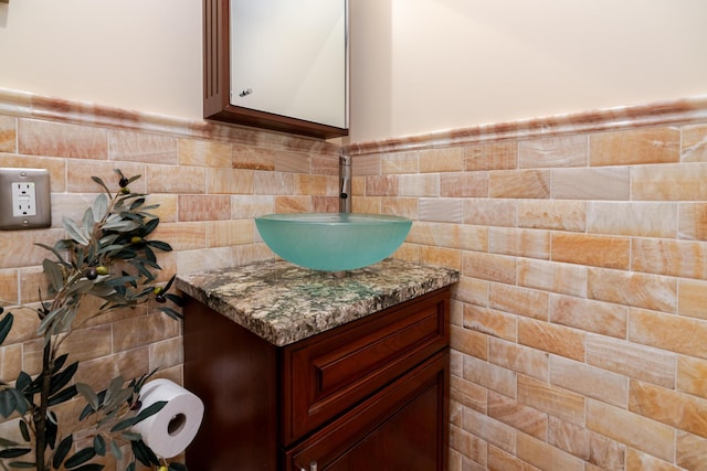 2738 E Broad St, Columbus, OH 43209 - bathroom view of vanity, tile walls, and wainscoting