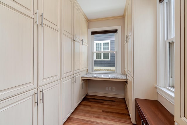 2738 E Broad St, Columbus, OH 43209 - spacious closet with light wood-style flooring and built in desk