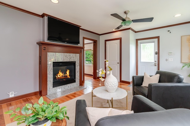 2738 E Broad St, Columbus, OH 43209 - living room with light wood-style flooring, a ceiling fan, healthy amount of natural light, crown molding, and a fireplace
