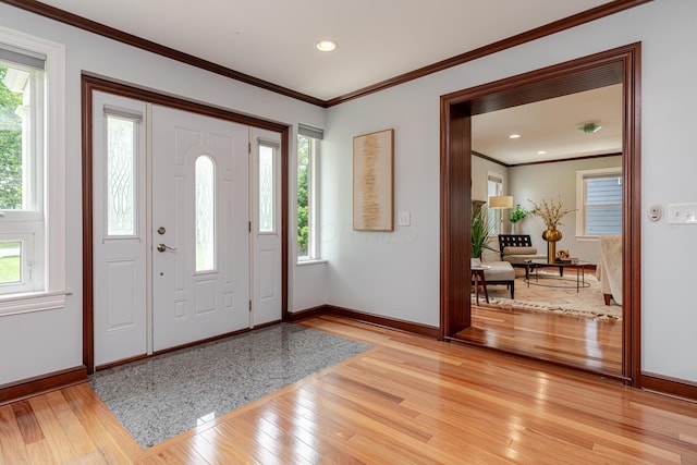 2738 E Broad St, Columbus, OH 43209 - foyer entrance with light wood finished floors, healthy amount of natural light, crown molding, and recessed lighting