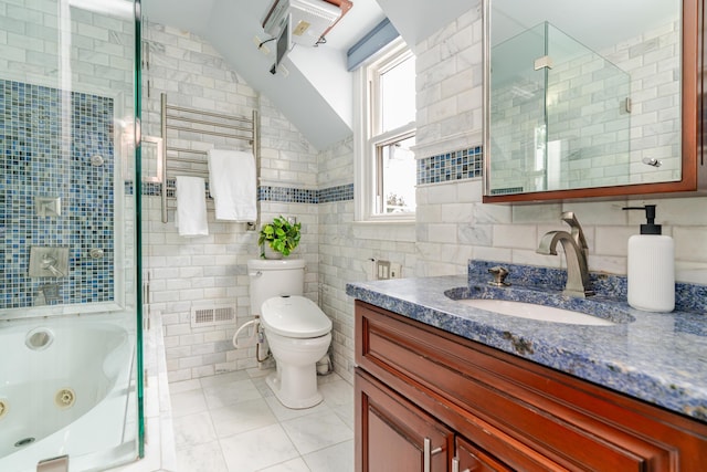 2738 E Broad St, Columbus, OH 43209 - full bath featuring tile walls, vanity, tile patterned flooring, and lofted ceiling