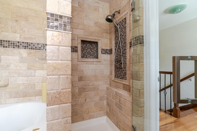 2738 E Broad St, Columbus, OH 43209 - full bath featuring tiled shower, a bathtub, and wood finished floors
