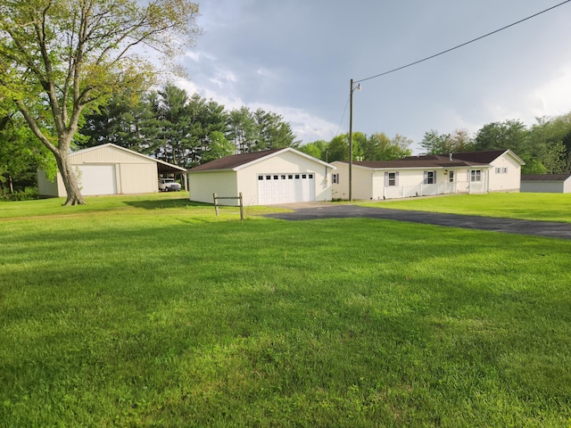 5747 E Clinton St, Albany, OH 45710 - view of green lawn with a garage