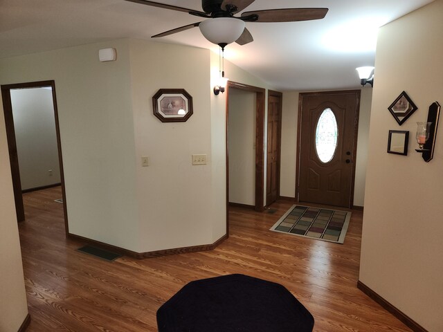 5747 E Clinton St, Albany, OH 45710 - entrance foyer featuring wood finished floors, a ceiling fan, baseboards, and vaulted ceiling