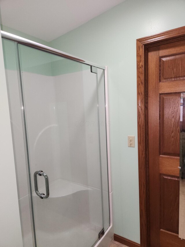 5747 E Clinton St, Albany, OH 45710 - bathroom featuring a shower stall and baseboards