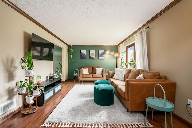 2862 Shady Ridge Dr, Columbus, OH 43231 - living area with ornamental molding, wood finished floors, a textured ceiling, and baseboards