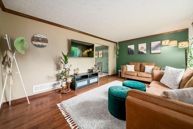 2862 Shady Ridge Dr, Columbus, OH 43231 - living area featuring wood finished floors, crown molding, baseboards, and a textured ceiling