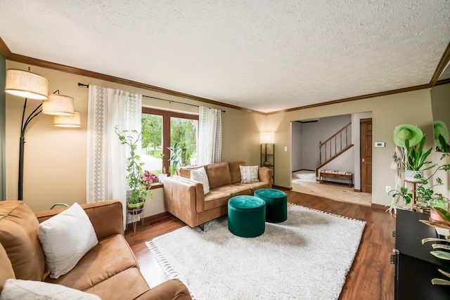2862 Shady Ridge Dr, Columbus, OH 43231 - living room with stairs, crown molding, wood finished floors, a textured ceiling, and baseboards