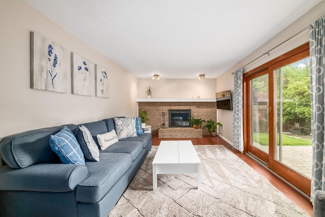 2862 Shady Ridge Dr, Columbus, OH 43231 - living room with wood finished floors and a brick fireplace