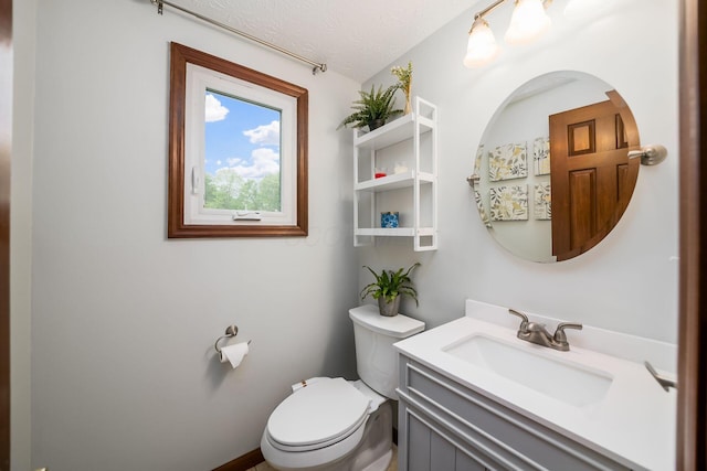 2862 Shady Ridge Dr, Columbus, OH 43231 - bathroom with toilet, vanity, and a textured ceiling