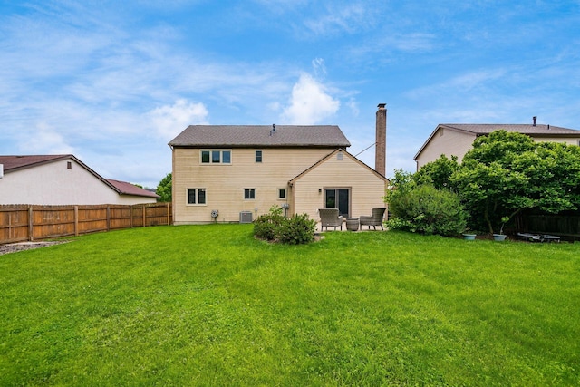 2862 Shady Ridge Dr, Columbus, OH 43231 - rear view of house featuring cooling unit, a patio area, and a chimney