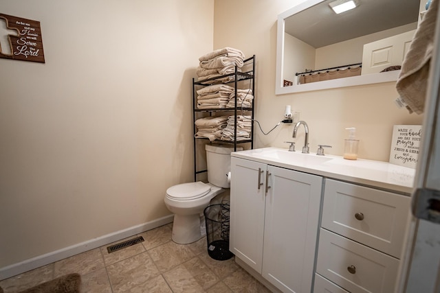 2025 Little Creek Rd, Frankfort, OH 45628 - bathroom featuring vanity, toilet, and baseboards