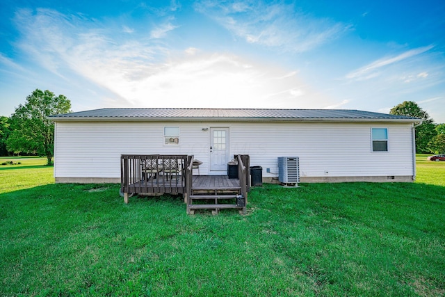 2025 Little Creek Rd, Frankfort, OH 45628 - back of house featuring central air condition unit, a wooden deck, a lawn, and metal roof
