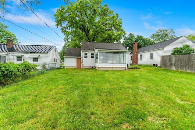 157 E Dominion Blvd, Columbus, OH 43214 - rear view of property featuring a chimney