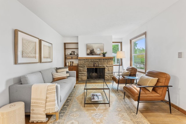 157 E Dominion Blvd, Columbus, OH 43214 - living room with light wood-style flooring, baseboards, and a stone fireplace