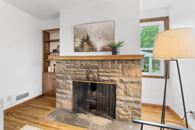 157 E Dominion Blvd, Columbus, OH 43214 - detailed view of wood finished floors, baseboards, and a fireplace