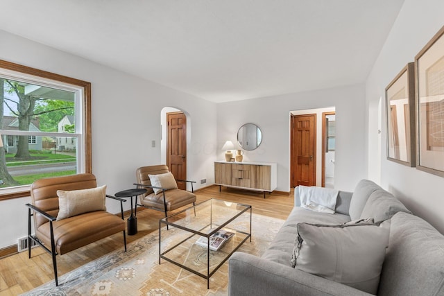 157 E Dominion Blvd, Columbus, OH 43214 - living room featuring arched walkways and light wood-type flooring