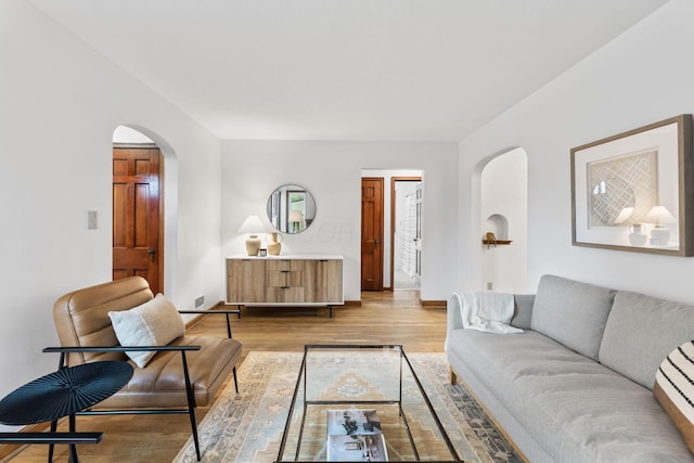 157 E Dominion Blvd, Columbus, OH 43214 - living area featuring arched walkways, light wood-style floors, and baseboards