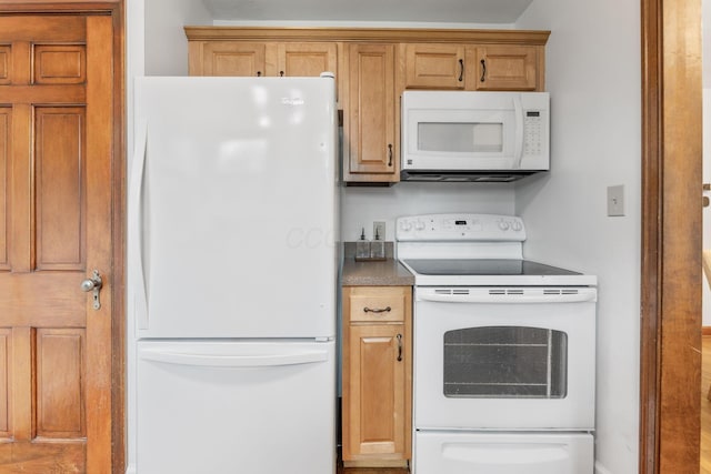 157 E Dominion Blvd, Columbus, OH 43214 - kitchen featuring white appliances and brown cabinetry