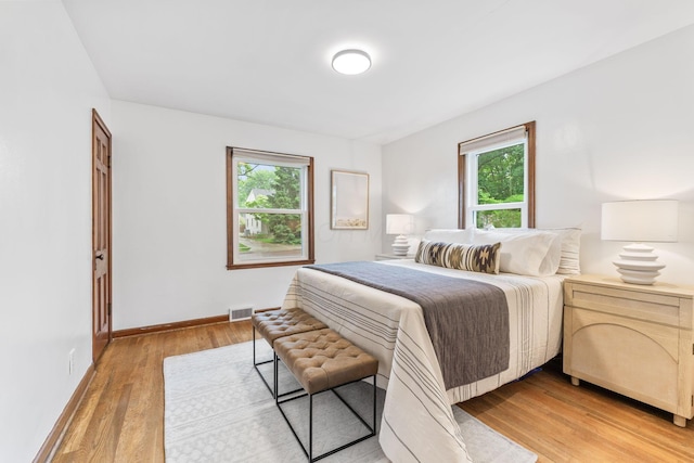 157 E Dominion Blvd, Columbus, OH 43214 - bedroom featuring multiple windows, light wood-type flooring, and baseboards
