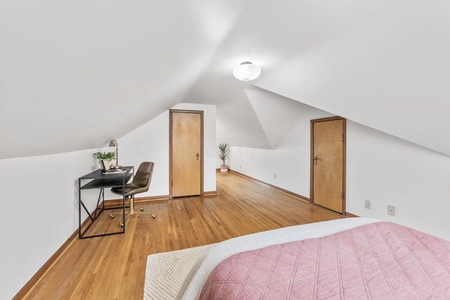 157 E Dominion Blvd, Columbus, OH 43214 - bedroom with light wood-style flooring, lofted ceiling, and baseboards