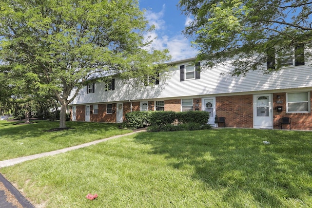 2294 Perkins Ct, Columbus, OH 43229 - view of front of house with brick siding and a front yard