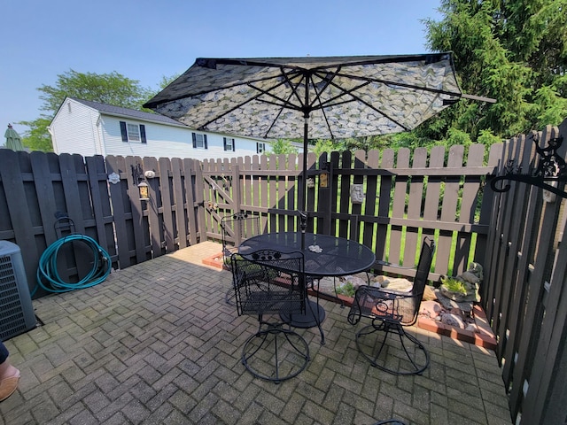 2294 Perkins Ct, Columbus, OH 43229 - view of patio featuring outdoor dining space and central air condition unit