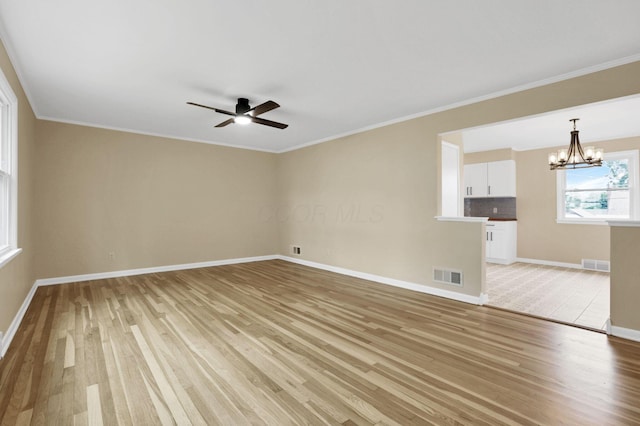 1783 Glenmar Dr, Lancaster, OH 43130 - empty room with light wood-style floors, a chandelier, baseboards, a ceiling fan, and crown molding