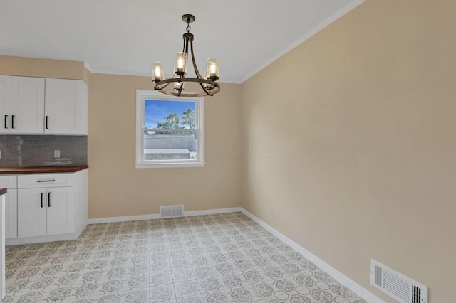 1783 Glenmar Dr, Lancaster, OH 43130 - unfurnished dining area with a chandelier, baseboards, and ornamental molding