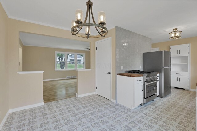 1783 Glenmar Dr, Lancaster, OH 43130 - kitchen with a chandelier, stainless steel appliances, butcher block counters, white cabinetry, and open floor plan