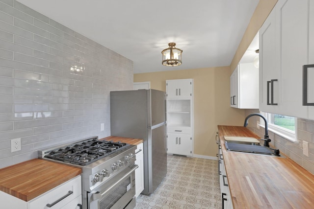 1783 Glenmar Dr, Lancaster, OH 43130 - kitchen with butcher block countertops, stainless steel appliances, a sink, and tasteful backsplash