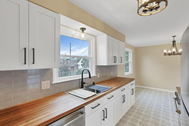 1783 Glenmar Dr, Lancaster, OH 43130 - kitchen with wooden counters, a chandelier, a sink, and plenty of natural light