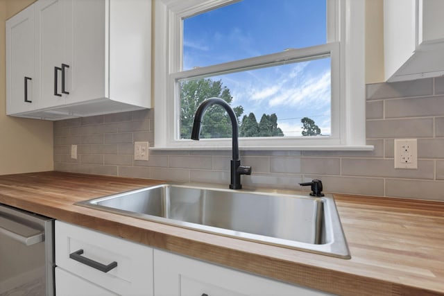 1783 Glenmar Dr, Lancaster, OH 43130 - kitchen featuring butcher block countertops, a sink, dishwasher, white cabinets, and decorative backsplash
