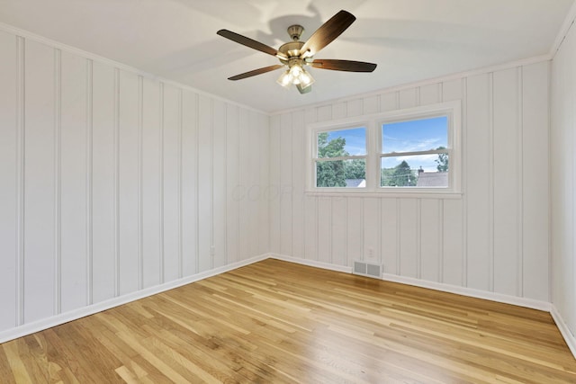 1783 Glenmar Dr, Lancaster, OH 43130 - spare room featuring light wood-style floors, baseboards, ceiling fan, and a decorative wall