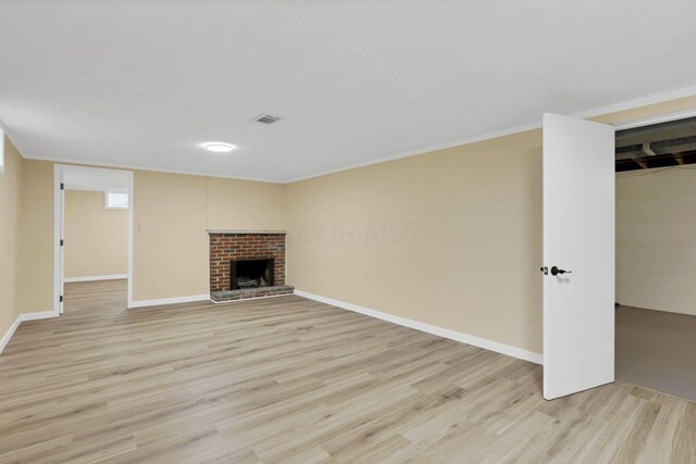 1783 Glenmar Dr, Lancaster, OH 43130 - unfurnished living room featuring light wood finished floors, baseboards, a fireplace, and ornamental molding