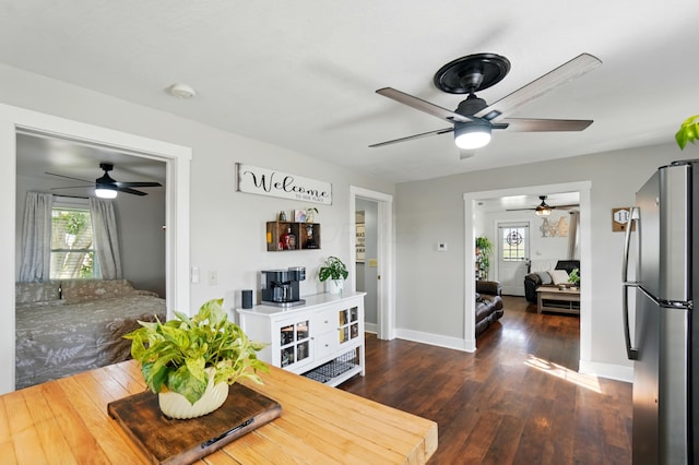 11725 Old Columbus Rd, South Vienna, OH 45369 - dining room with ceiling fan, dark wood finished floors, and baseboards