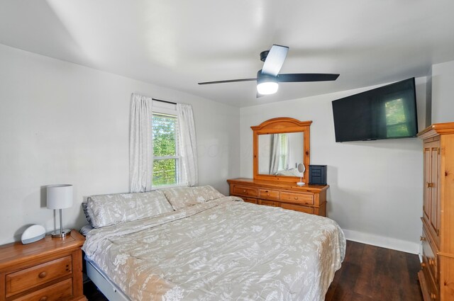 11725 Old Columbus Rd, South Vienna, OH 45369 - bedroom featuring dark wood finished floors, baseboards, and ceiling fan