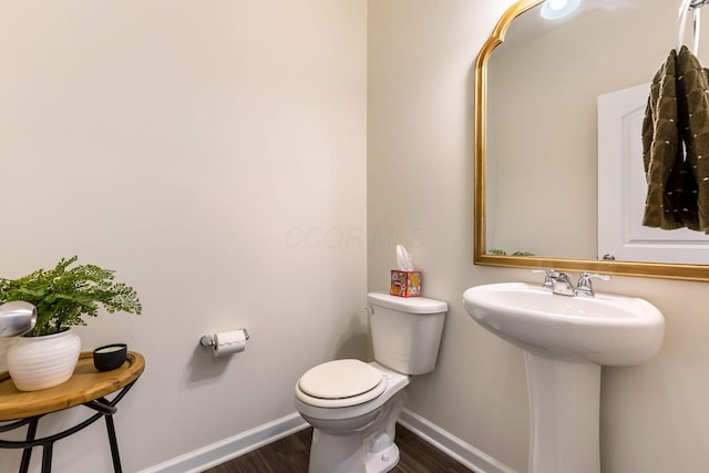 324 Raccoon Ave, Johnstown, OH 43031 - bathroom with baseboards, toilet, wood finished floors, and a sink