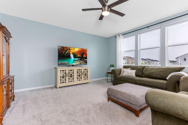 324 Raccoon Ave, Johnstown, OH 43031 - carpeted living area with a ceiling fan and baseboards
