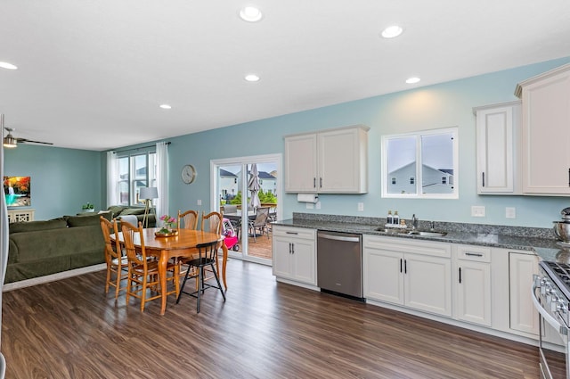 324 Raccoon Ave, Johnstown, OH 43031 - kitchen featuring stainless steel appliances, a sink, open floor plan, dark wood-type flooring, and white cabinetry