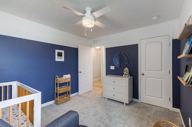 324 Raccoon Ave, Johnstown, OH 43031 - bedroom with carpet flooring, baseboards, a nursery area, and ceiling fan