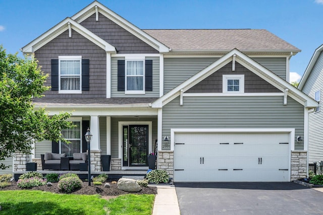 2991 Green Line Way, Columbus, OH 43231 - craftsman-style house with a porch, asphalt driveway, stone siding, and a shingled roof