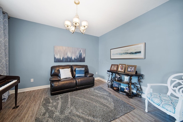 2991 Green Line Way, Columbus, OH 43231 - living room featuring wood finished floors, a chandelier, and baseboards