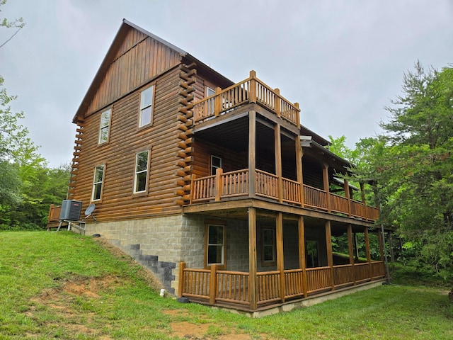 21760 State Route 93, Logan, OH 43138 - back of property with log exterior, a lawn, and a deck