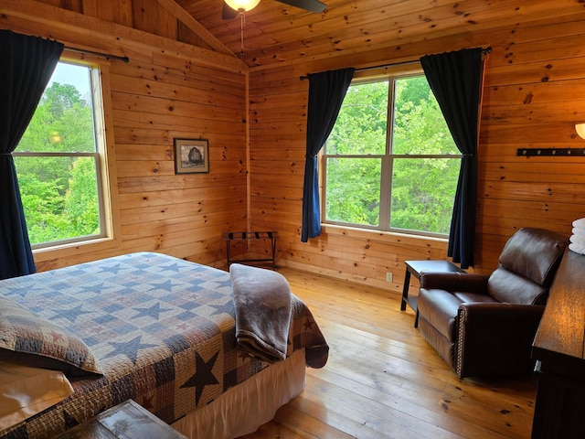 21760 State Route 93, Logan, OH 43138 - bedroom featuring vaulted ceiling, wood walls, light wood finished floors, and wooden ceiling